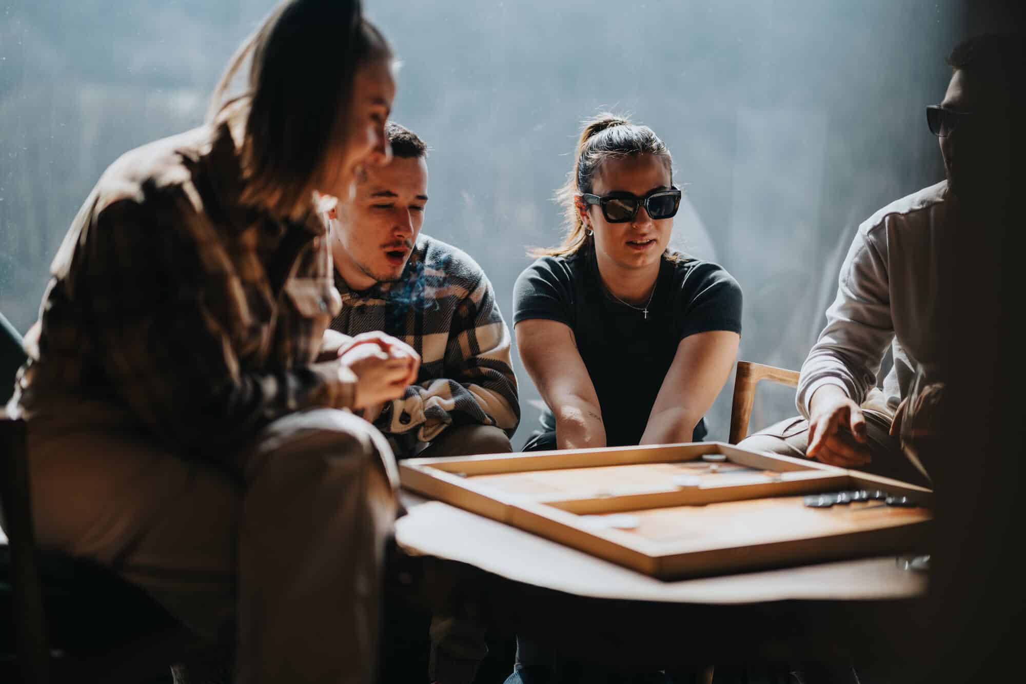 sober new years eve idea: people playing board games